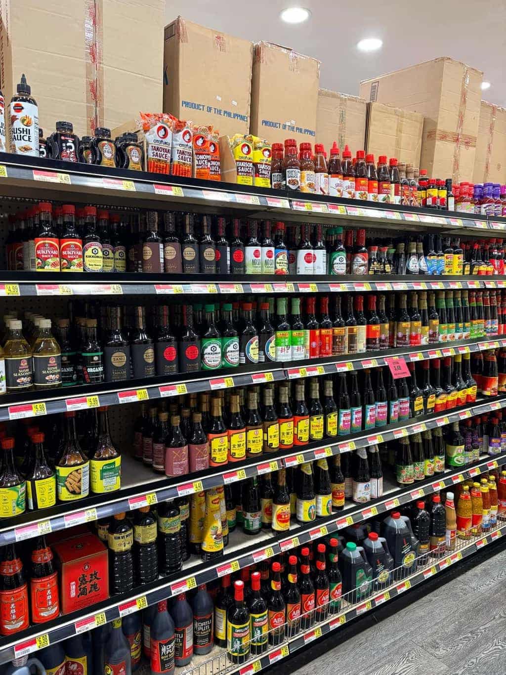 Shelf of dozens of soy sauce brands at Asian Market Escondido